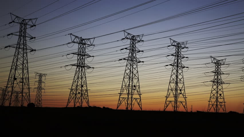 Pan of electrical power lines and pylons at dusk Royalty-Free Stock Footage #10728566