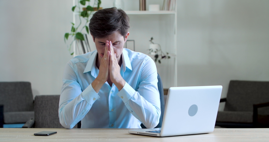 Shocked frustrated caucasian millennial business man student feel stressed look at computer screen worried of problem read bad online news receive failed exam results concept sit at home office table | Shutterstock HD Video #1072858478