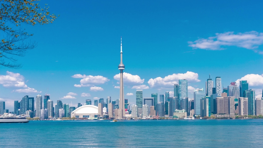 4K timelapse of daytime view of Toronto skyline and Lake Ontario during spring summer as seen from Toronto island,Toronto, Ontario Canada