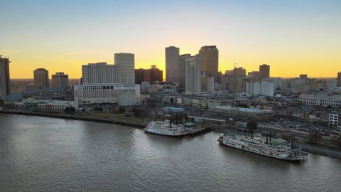 New Orleans Louisiana Mississippi River Aerial Shot at Sunset Skyline of Big Easy with Ferrys
