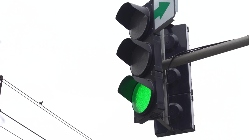 Traffic light on the road regulates traffic Royalty-Free Stock Footage #1072876514