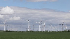 renewable energy, landscape with wind mill, wind turbine working in a wind park
