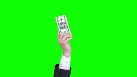 money, cash. Gif animation. close-up. male hand, in business suit, holds hundred dollar bills bundle, waves it. isolated on green background. looping seamless pattern. animation