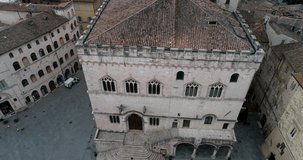 Aerial drone view of Perugia, in Umbria. Details of city. Morning shot of the church and the square, breathtaking view. With the detail of the fountain and bells. 