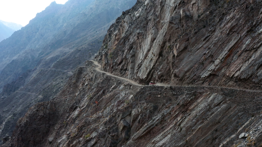 Car driving on the dangerous mountain road to Fairy Meadows, Himalaya | Shutterstock HD Video #1072915442