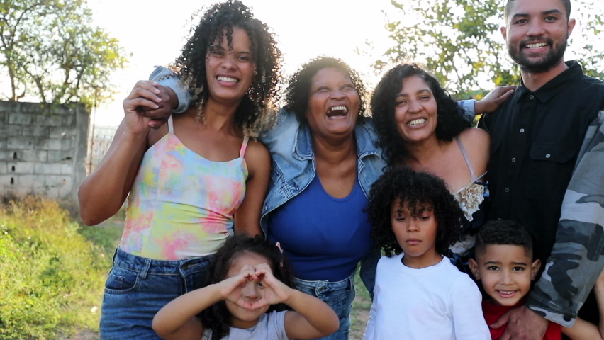 Happy casual hispanic family posing outside. South American latin parents and children | Shutterstock HD Video #1072915586