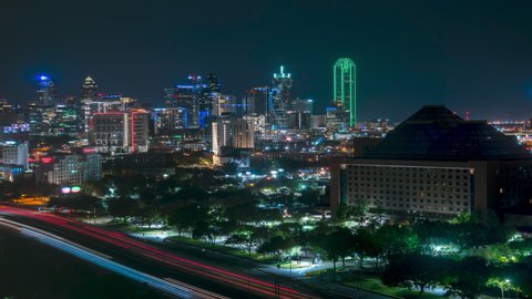 Night to Day Time Lapse of the Dallas Skyline with Dense Traffic in the Highway