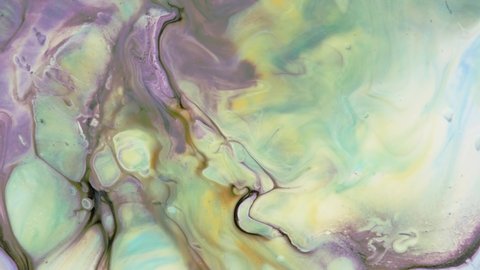 Cellular structure is purple in hue. Pastel colors of paint stains. Abstract light pastel streams flow along the plane on a blue background. Marble texture. Fluid art. Liquid abstractions.