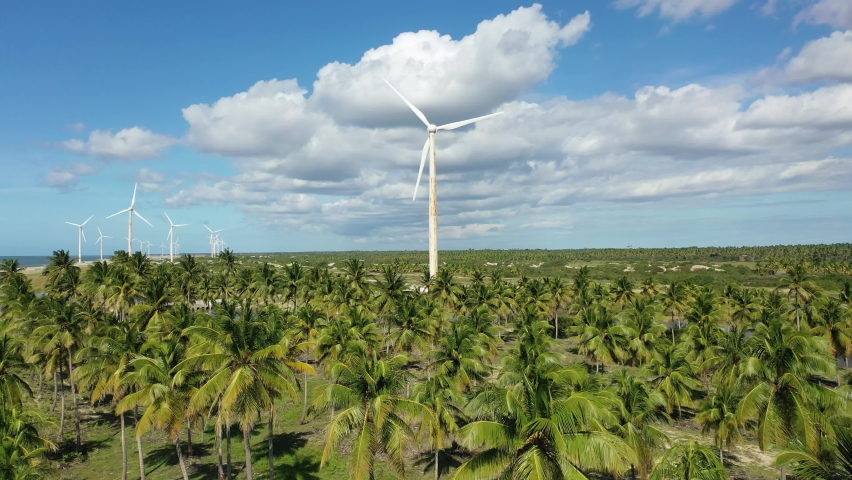 Rural landscape of clean energy wind farm at near Jericoacoara, Ceara, Brazil. Aeolian turbine. Aeolian energy. Sustainable energy turbines. Clean energy to control climate change. Rural landscape. Royalty-Free Stock Footage #1072917839