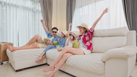 Happy Asian people stay home, Parents spend time with children due Covid-19 lockdown. Family Traveller watching TV screen, pretending they on beach during summer in house. Dream vacation trip concept. - Powered by Shutterstock - Get 15% off with code: PIKWIZARD15