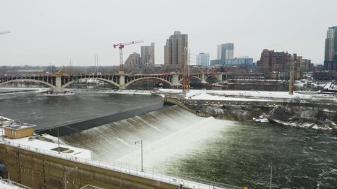 Drone Flies Over St. Anthony Falls on Freezing Day in Minneapolis, Minnesota. Push In