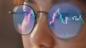 Closeup - Female eyes in eyeglasses late at night scrolling in front of laptop. Coder, she checking Bitcoin price chart on digital exchange on smartphone, cryptocurrency future price action prediction - Powered by Shutterstock - Get 15% off with code: PIKWIZARD15