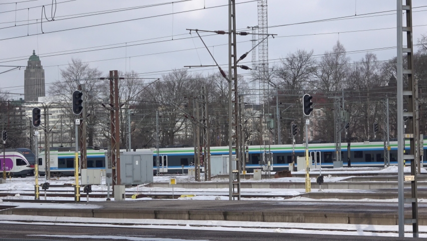 The train is approaching slowly the Central Railway Station of Helsinki in Finland.