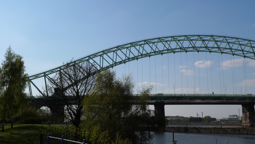 Silver Jubilee Bridge and railway bridge pan from Runcorn to Widnes. It