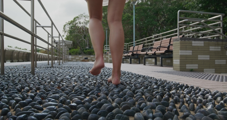 Woman walk on stone path