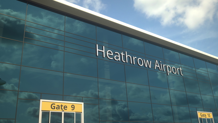 Airliner take off reflecting in the windows with Heathrow Airport text Royalty-Free Stock Footage #1072958459