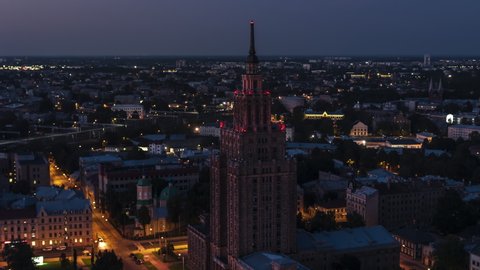 Establishing Aerial View Shot of Riga, Riga skyline, Latvia at night evening