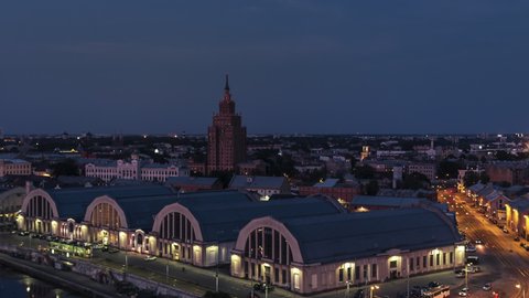 Establishing Aerial View Shot of Riga, Riga skyline, Latvia at night evening