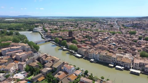 France, Agde, downtown with Saint-Etienne church, mediterranean sea in back, drone aerial view