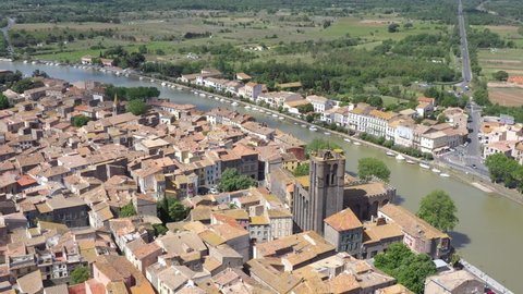 France, Agde, downtown with Saint-Etienne church, foreward drone aerial view