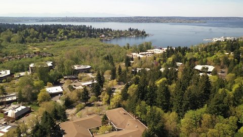 Cinematic 4K aerial drone clip of Lakeview, Central Houghton, Marina Park Pavilion, Yarrow Bay, Lake Washington commercial, residential neighborhoods near Bellevue and Seattle, King County, Washington
