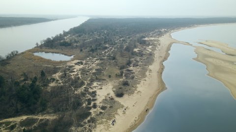 Panoramic View Of Mewia Lacha With People On Dune Seashore In Sobieszewo Island, Bay Of Gdansk, Baltic Sea, Poland. - Aerial Pullback Shot