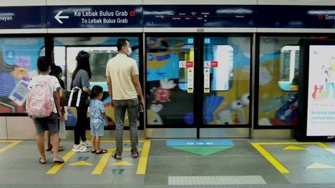 Jakarta, Indonesia - May 2021: passengers ride mrt train at senayan station in south jakarta

