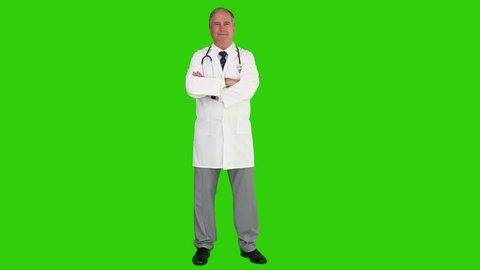 Chroma-key footage of a mature doctor with a stethoscope looking at the camera, Healthcare workers in the Coronavirus Covid19 pandemic