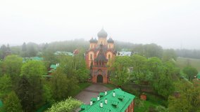 Aerial view of Pühtitsa Convent in Ida-Virumaa, Estonia on a foggy day. Kuremäe is largest Orthodox community in the Baltic states.
