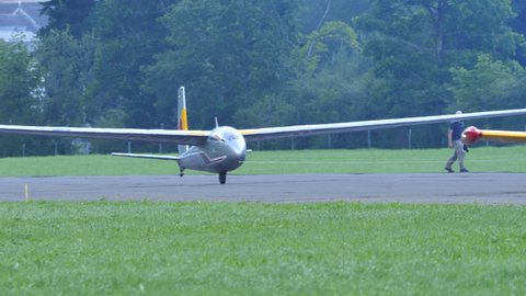 Zigermeet Airshow in Mollis Switzerland August 16th 2019. Close-up shot of a historic glider taking off towed by an airplane. Let L-13 Blanik of the Red Bull Blanix Team