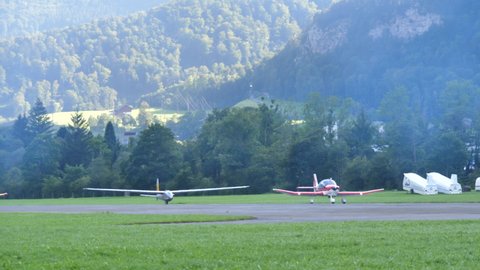 Zigermeet Airshow in Mollis Switzerland August 16th 2019. Historic glider takes off towed by a small plane. Let L-13 Blanik of the Red Bull Blanix Team