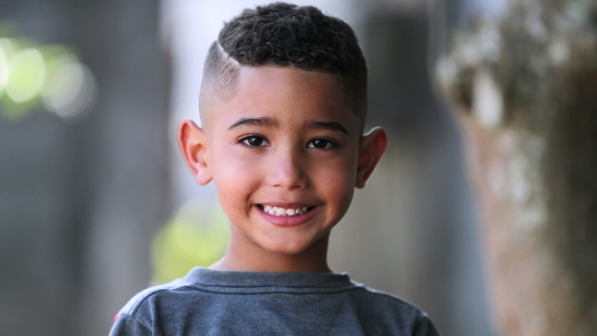 Hispanic child little boy portrait. Brazilian kid smiling | Shutterstock HD Video #1073023712