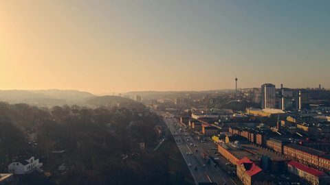 Traffic At Highway E6 Southbound With Gothia Tower And Liseberg Amusement Park In The Background At Sunrise In Gothenburg, Sweden. - aerial