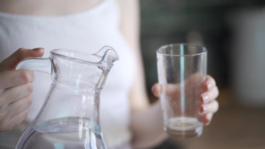 Beautiful Young Woman Pours Water 스톡 동영상 비디오(100% 로열티 프리) 1073031767 | Shutterstock