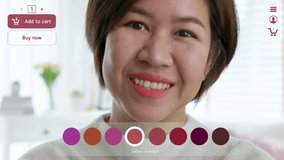 POV asia female woman relax happy smile enjoy home apply lips makeup on ai ar vr mixed augmented reality e-commerce future fashion mall app in iot smart touch web screen push buy select color button. - Powered by Shutterstock - Get 15% off with code: PIKWIZARD15
