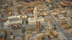 This panning video shows an aerial view of a small scale architectural replica of historical downtown Los Angeles streets and buildings. - Powered by Shutterstock - Get 15% off with code: PIKWIZARD15