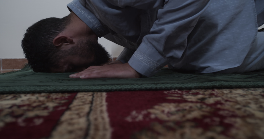religious muslim praying on his carpet ground angle Royalty-Free Stock Footage #1073041931