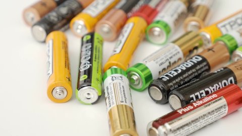 Ivanovo, Russia May 25, 2021, Lots of colorful AA and AAA batteries on a white background, close-up