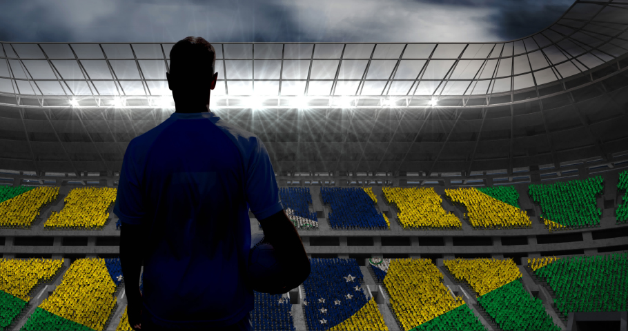 Animation of rear view of football player holding ball over brazilian flag in sports stadium. sports event and competition concept digitally generated video. | Shutterstock HD Video #1073044400