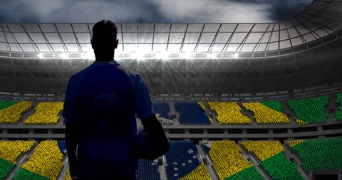 Animation of rear view of football player holding ball over brazilian flag in sports stadium. sports event and competition concept digitally generated video.