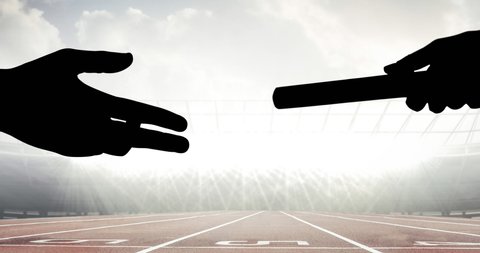 Animation of athlete's hands passing relay baton over racing track in sports stadium. sports event and competition concept digitally generated video.