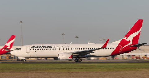 Melbourne, Australia - May 22, 2021: Qantas Boeing 737 airliner speeding down the runway as it departs from Melbourne Airport.