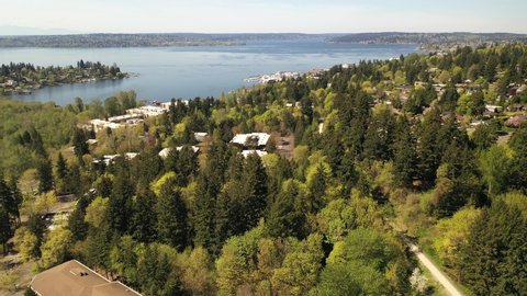 Cinematic 4K aerial drone shot of Lakeview, Central Houghton, Marina Park Pavilion, Yarrow Bay, Lake Washington commercial, residential neighborhoods near Bellevue and Seattle, King County, Washington