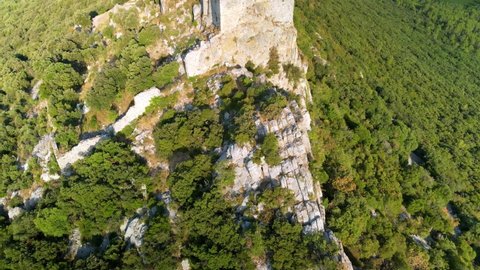 Aerial shots of the Castle of Montferrand (12th century) at the top of the mountain. We can see the Pic Saint Loup, the Hortus and the village of Saint Mathieu de Treviers in the southeast of France.
