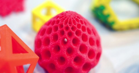 Objects printed by 3d printer. Bright colorful objects printed on a 3d printer