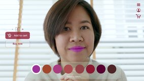 POV asia female woman relax happy smile enjoy home apply lips makeup on ai ar vr mixed augmented reality e-commerce future fashion mall app in iot smart touch web screen push buy select color button. - Powered by Shutterstock - Get 15% off with code: PIKWIZARD15