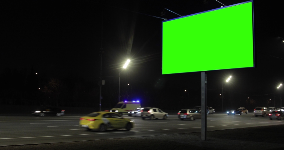 A billboard with a green screen on the highway in the night city.  | Shutterstock HD Video #1073063879