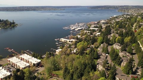 Cinematic 4K drone footage of Lakeview, Central Houghton, Marina Park Pavilion, Yarrow Bay, Lake Washington commercial, residential neighborhoods near Bellevue and Seattle, King County, Washington