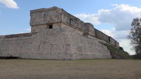 Uxmal, Yucatan, Mexico - APRIL 02, 2019:
Tpurist girls near the Governor's Palace of Uxmal ancient Mayan city. 