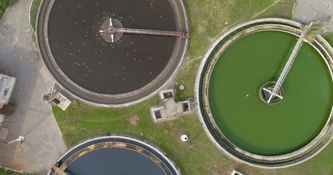 Wastewater treatment plant of a round shape top view. Water treatment facilities. Flying over a water treatment plant